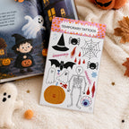 Temporäre Tattoos für Kinder mit Halloween Motiv auf Halloween-Buch liegend