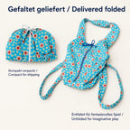 Blauer Puppentragesack gefaltet für den Versand und vollständig entfaltet im Vergleich