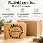 Weihnachts-Geschenkbox mit festlichem Weihnachtskranz neben einem schützenden Versandkarton. Hochwertige Geschenkverpackung zum einfachen Öffnen und persönlichen Ergänzen.